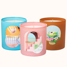 Three colorful candles with graphic designs on a white background
