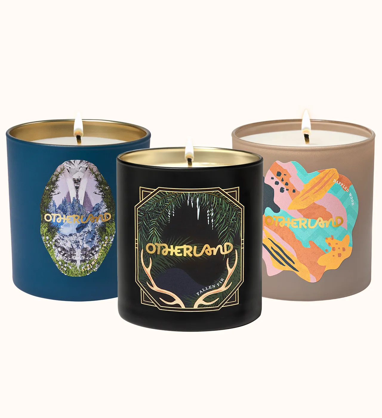 Three candles with 'Otherland' branding on a white background