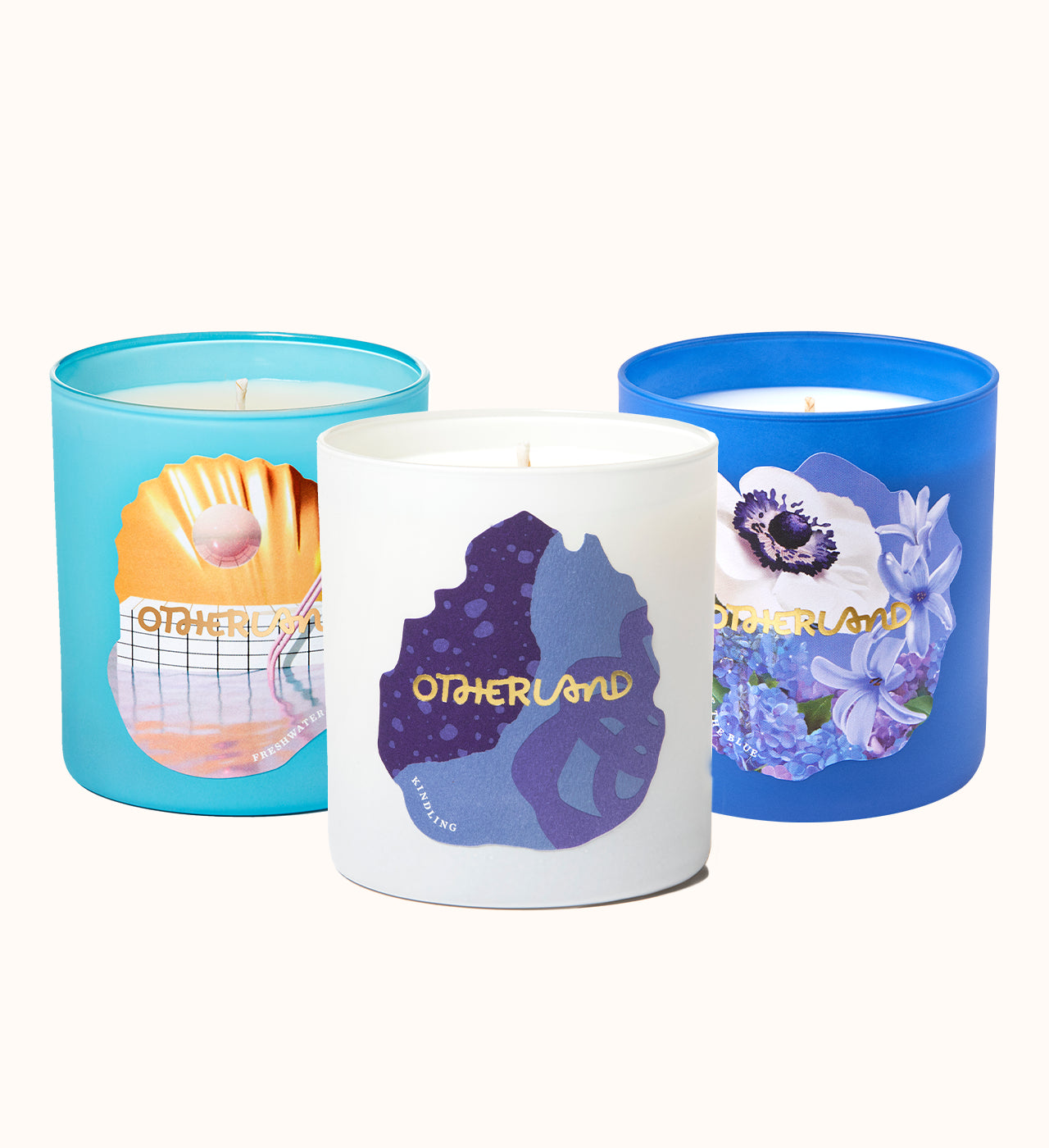 Three candles with colorful labels on a white background