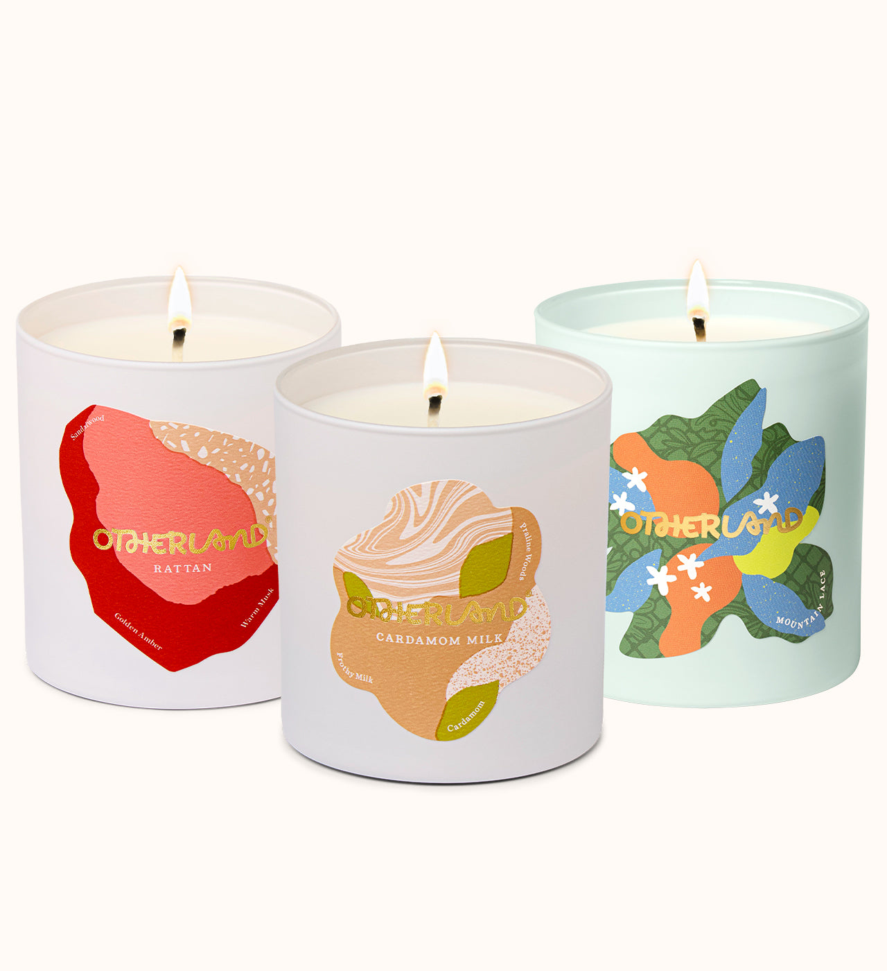 Three candles with colorful labels on a white background - View 1