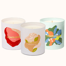 Three candles with colorful labels on a white background