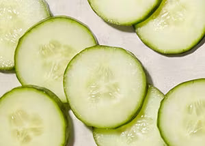 Sliced cucumbers on a white background