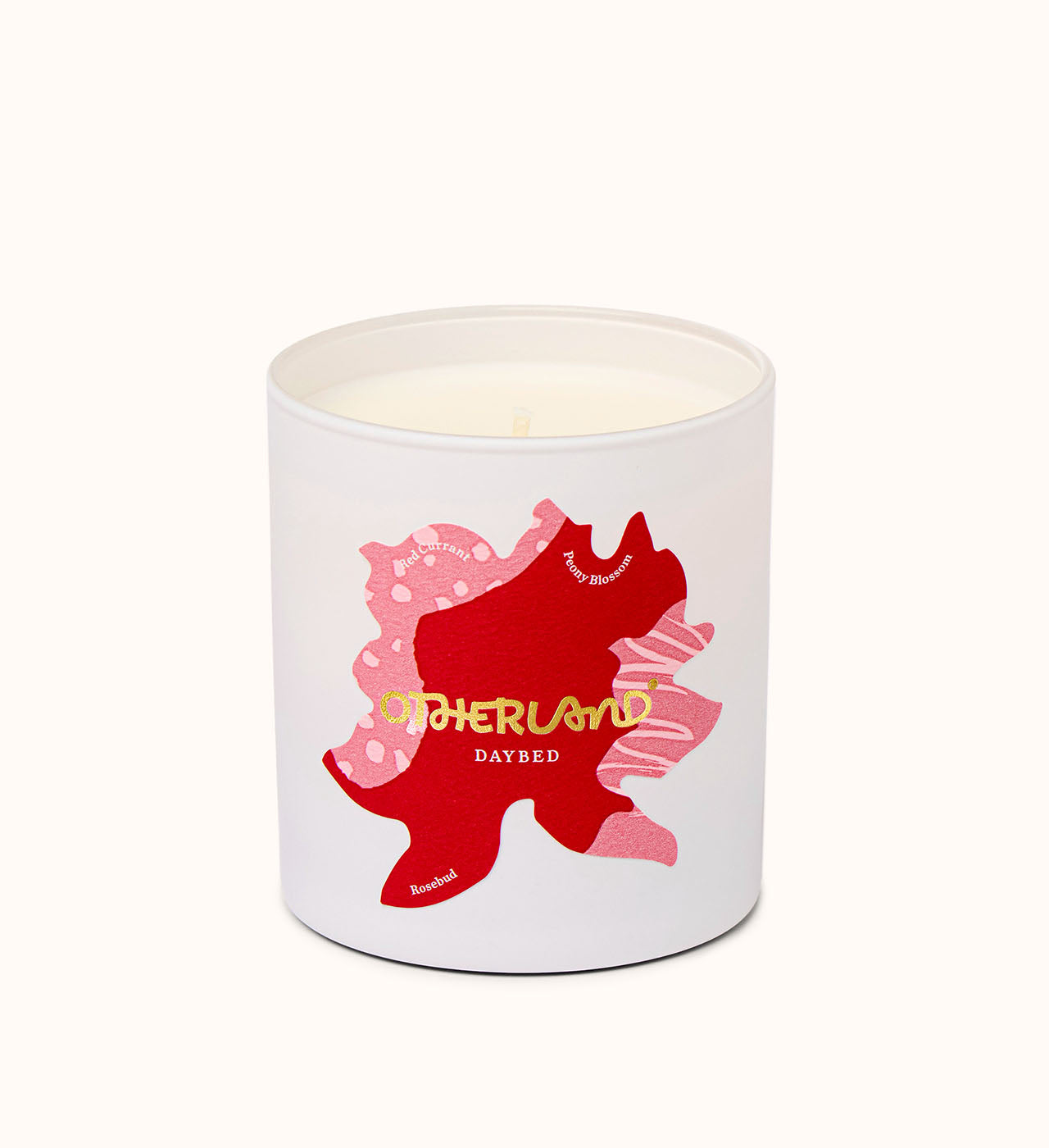 Daybed candle with a red and pink design on a white background