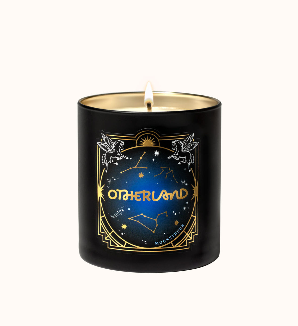 Black candle with 'Otherland' branding and celestial design on a white background