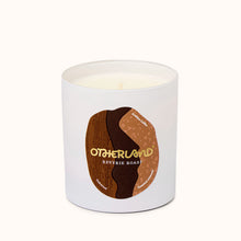 Reverie Roast candle with a brown label featuring 'Otherland' branding on a white background
