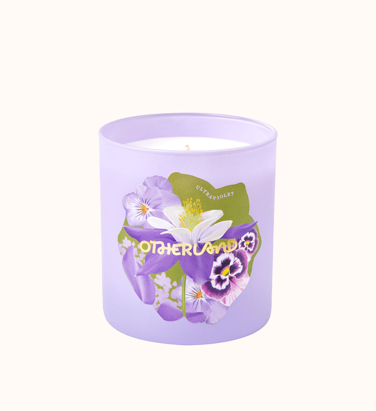Lavender candle with floral design and 'Otherland' branding on a white background