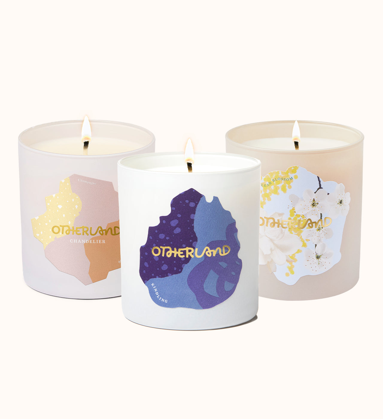 Three candles with colorful labels on a white background