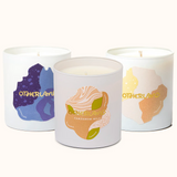 Three candles with colorful labels on a white background