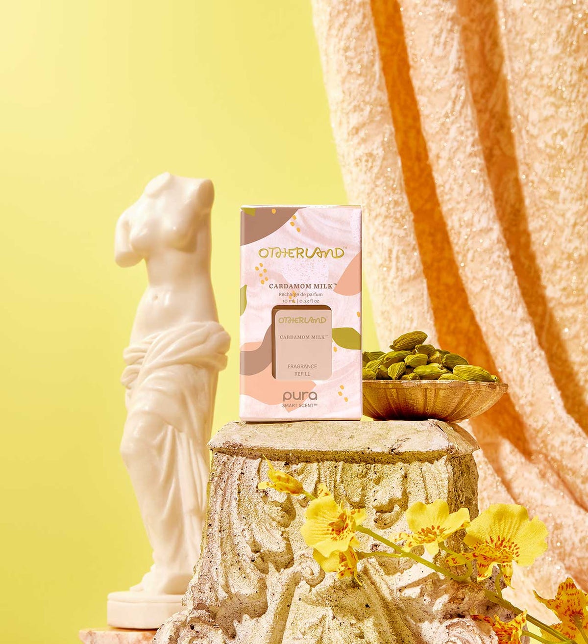 Pura refill product on a decorative stone pedestal with flowers and a statue against a yellow background