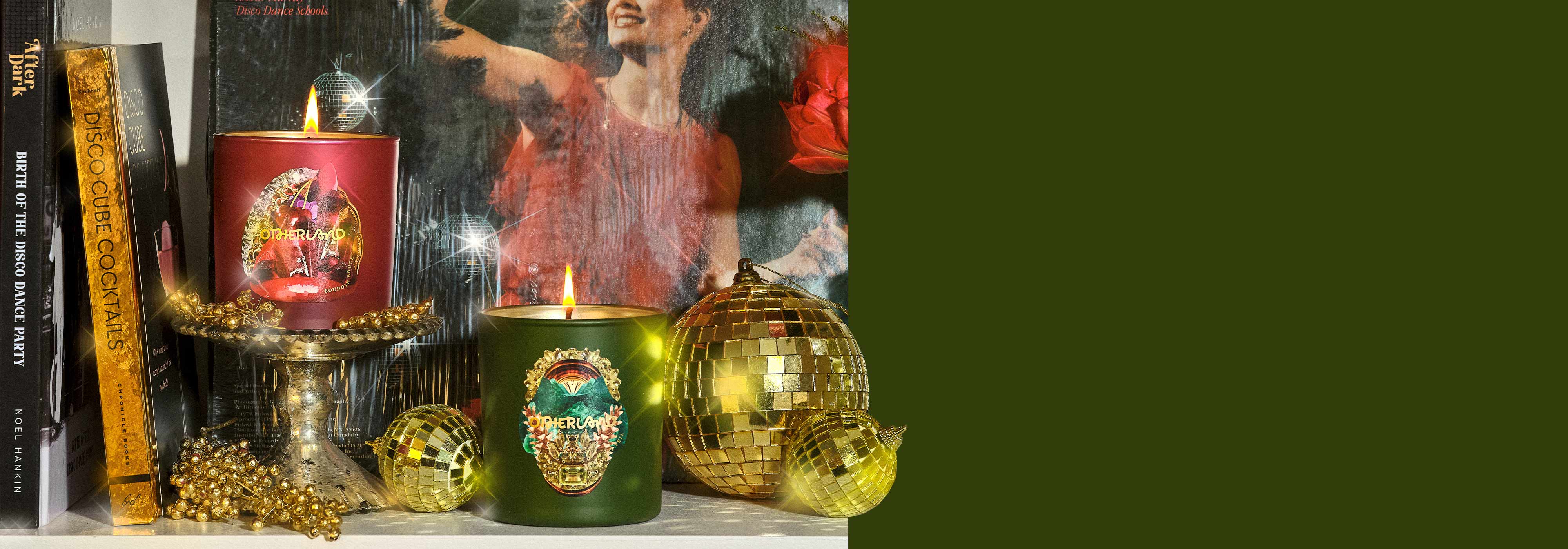 Forest Veil and Boudoir Rouge Single Wick Candle sitting on a festive shelf with books and holiday decor